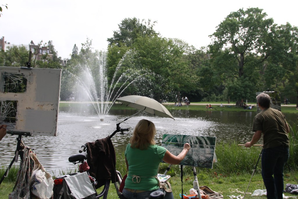 An art group painting the fountain in Vondelpark